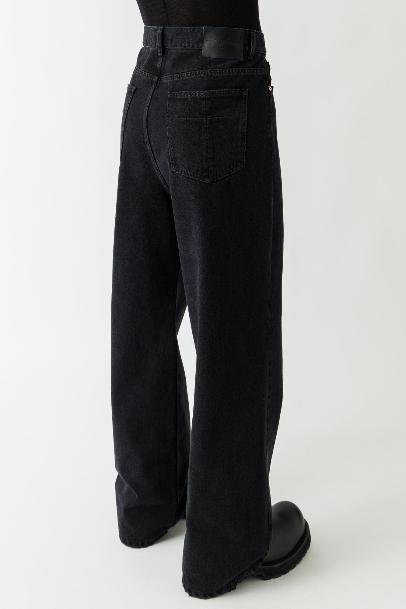 Matières Fécales Black Woven Jeans on man back