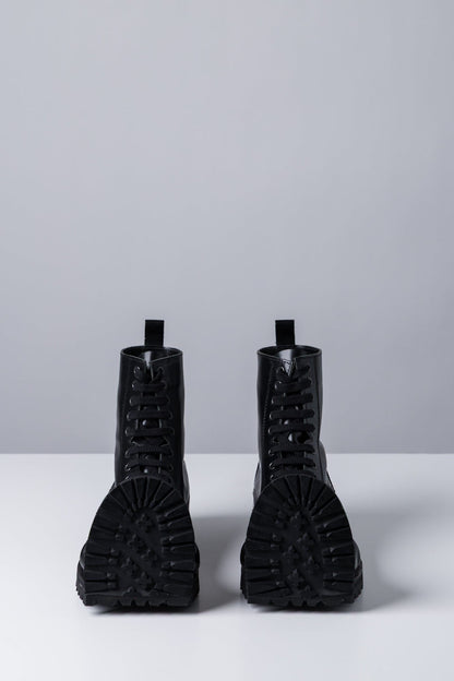 Comme des Garçons Homme Plus Warped Combat Boots front