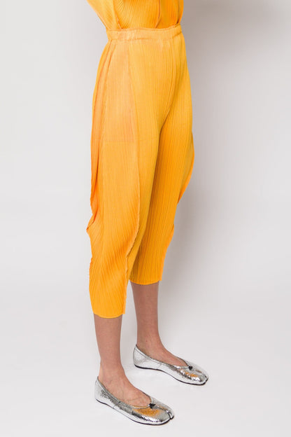 Pleats Please Issey Miyake Lantern Trousers in Orange Yellow SS25 side